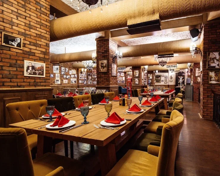 A restaurant set with red napkins
